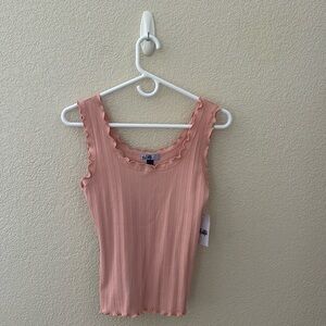 Peach ruffled tank top woman’s blouse. Very soft. Never been worn.